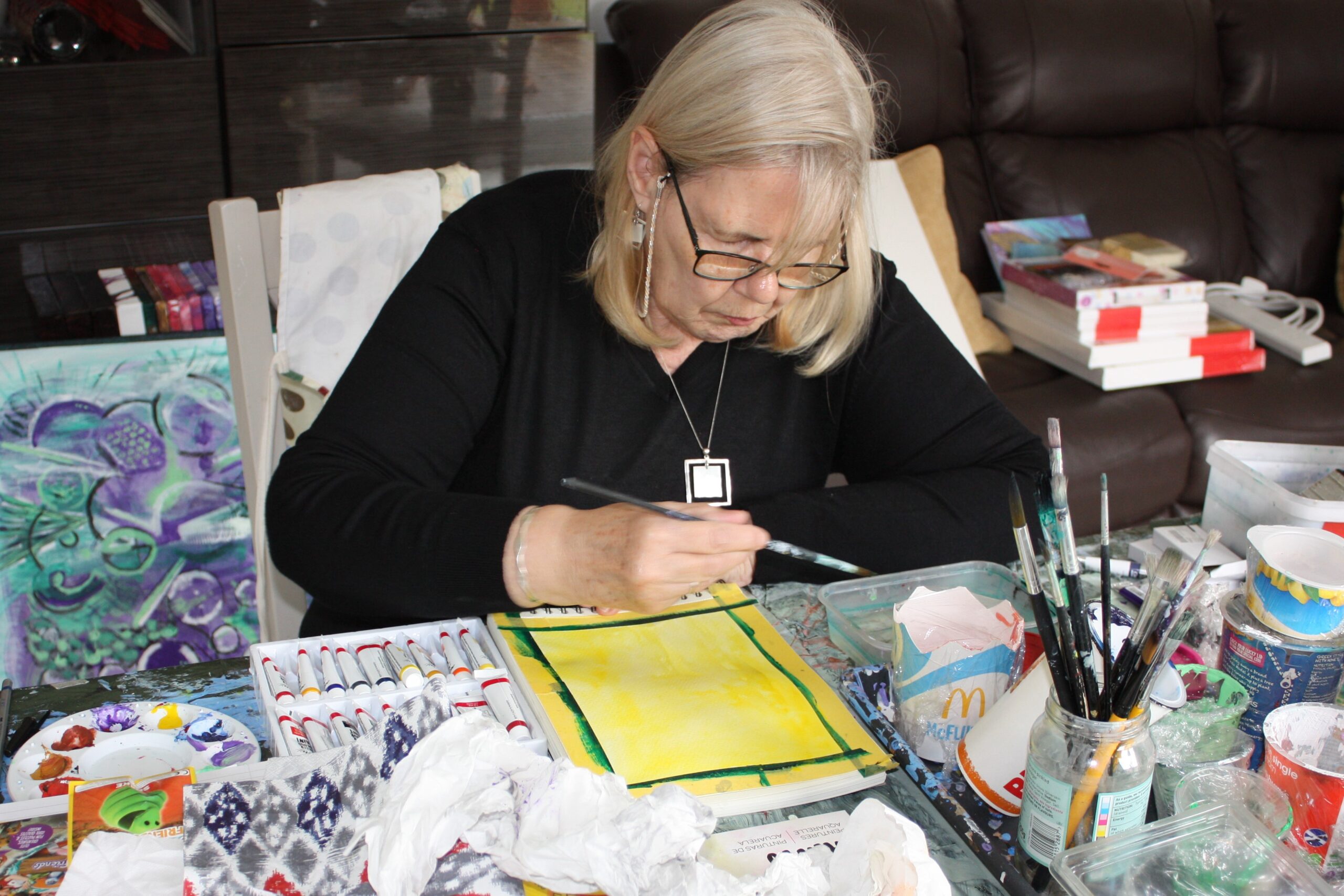 Lyn creating an abstract artwork